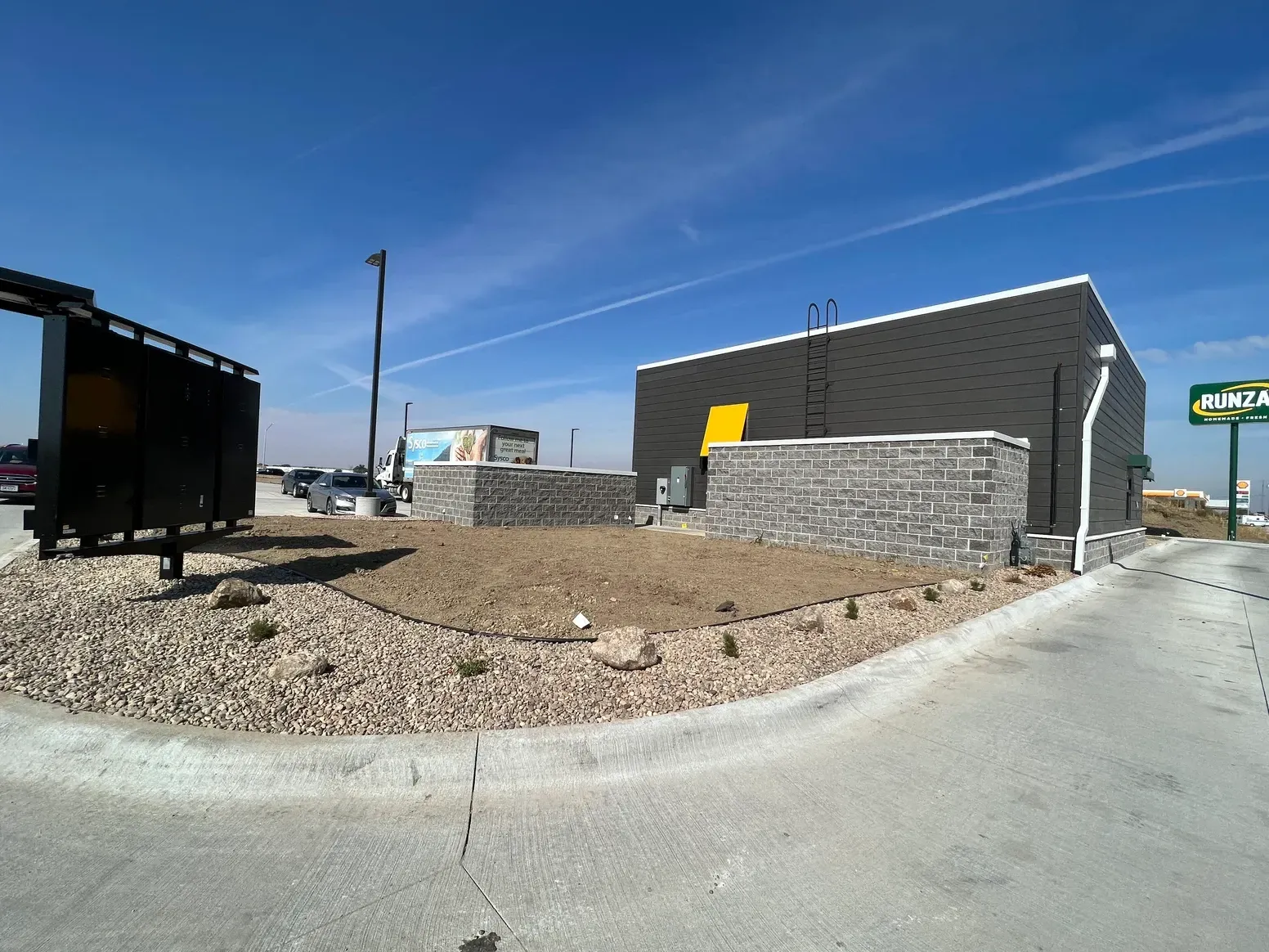 A Building with A Sign — Exeter, NE — Axline Landscaping & Trees
