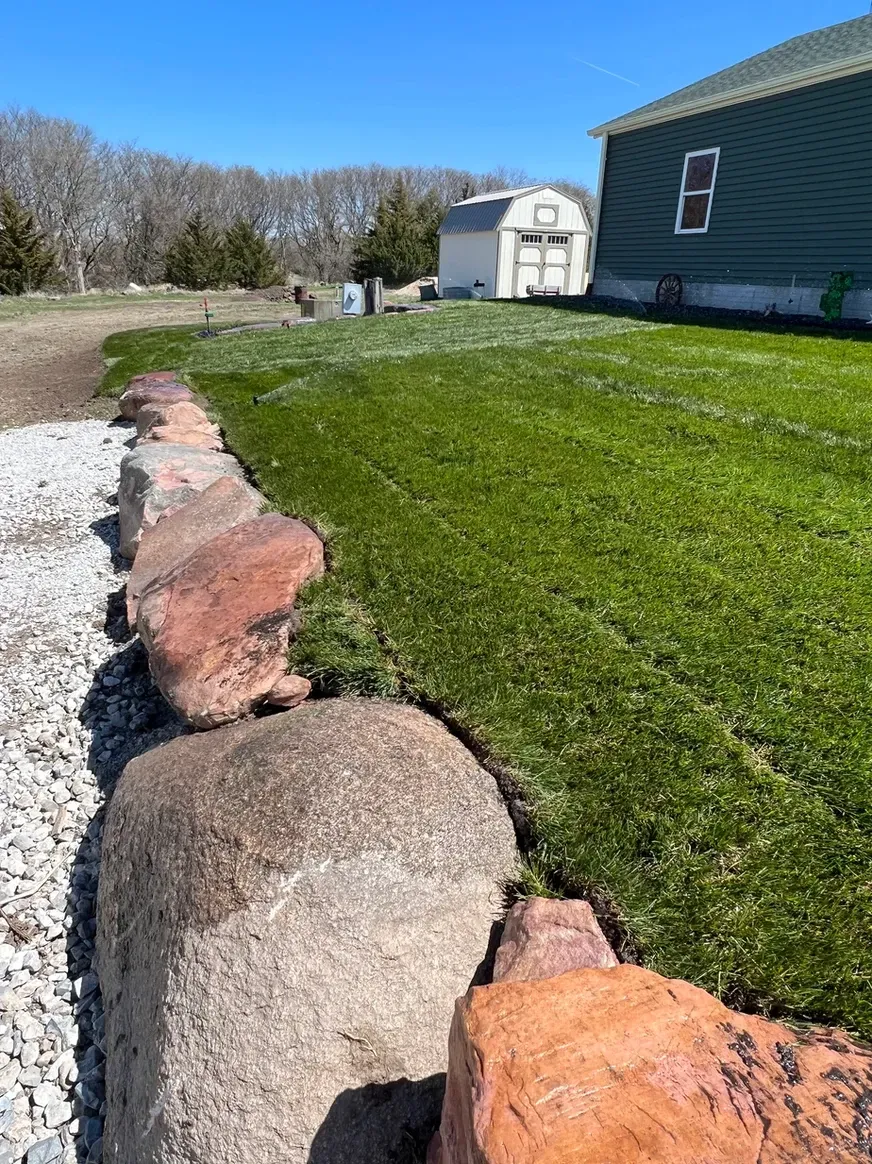 Lush Green Lawn with Rocks — Exeter, NE — Axline Landscaping & Trees