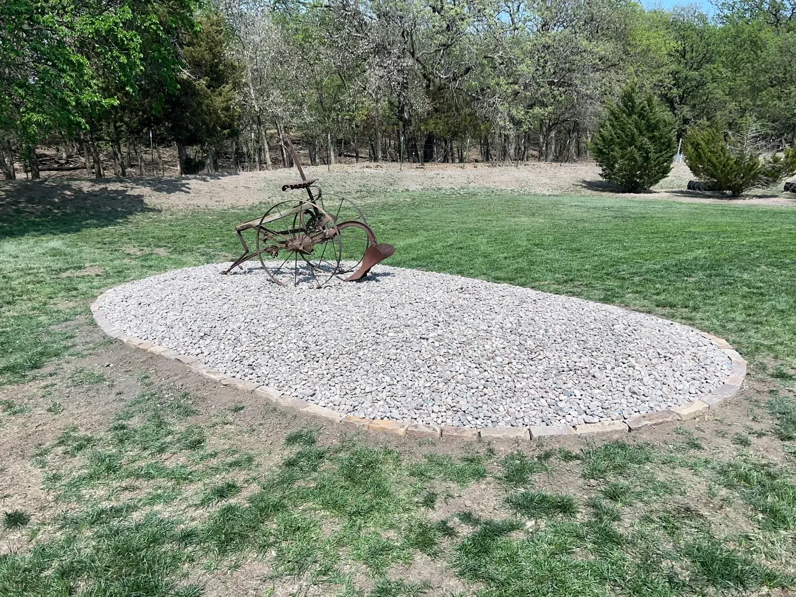 Sculpture in The Middle of A Grassy Field — Exeter, NE — Axline Landscaping & Trees