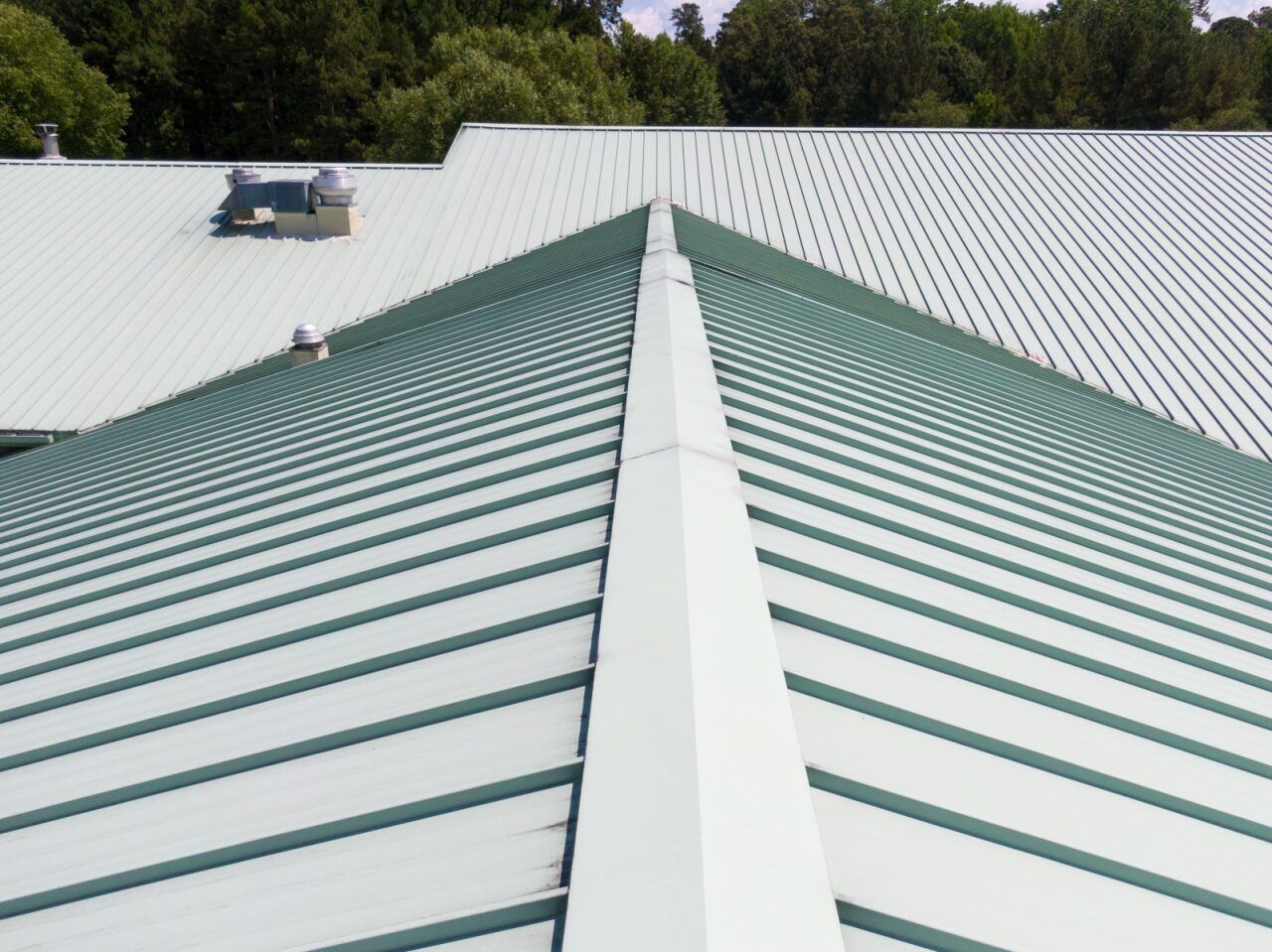 Green and White Metal Roof With Ridgeline — Coffs Coast Roofing In Nambucca, NSW