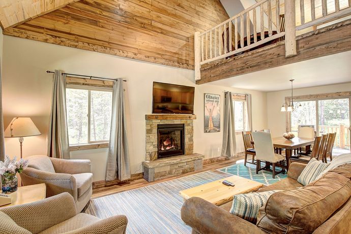 A living room filled with furniture and a fireplace.