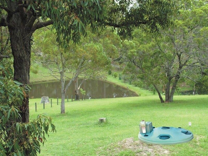 A Green Circle in the Middle of a Grassy Field — Fastcall Group In Herbert, NT
