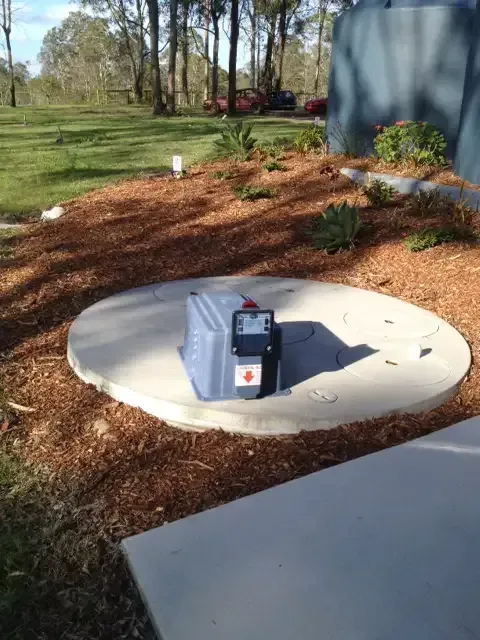 A Blue Box With a Red Cross on It is Sitting on Top of a Concrete Circle — Fastcall Group In Herbert, NT