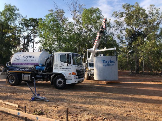 A Vacuum Truck is Parked Next to a Large Tank — Fastcall Group In Herbert, NT