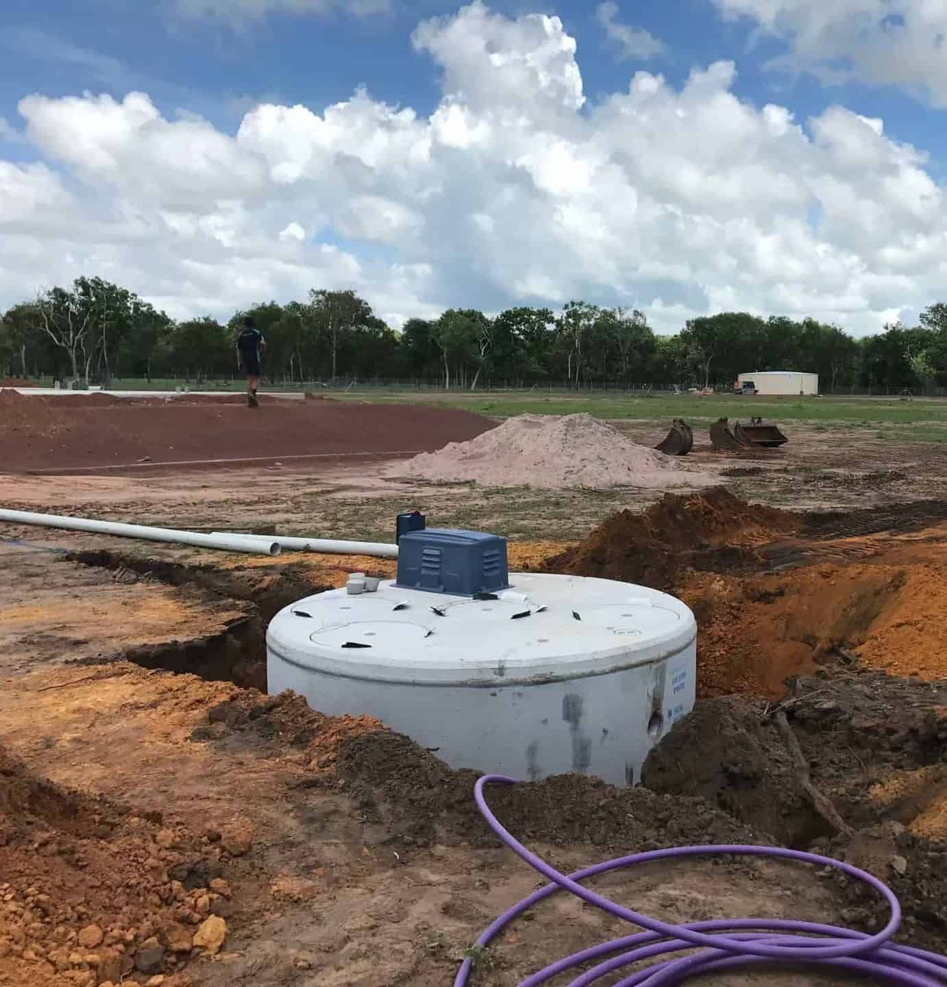 A Large Concrete Cylinder is Sitting in the Middle of a Dirt Field — Fastcall Group In Herbert, NT