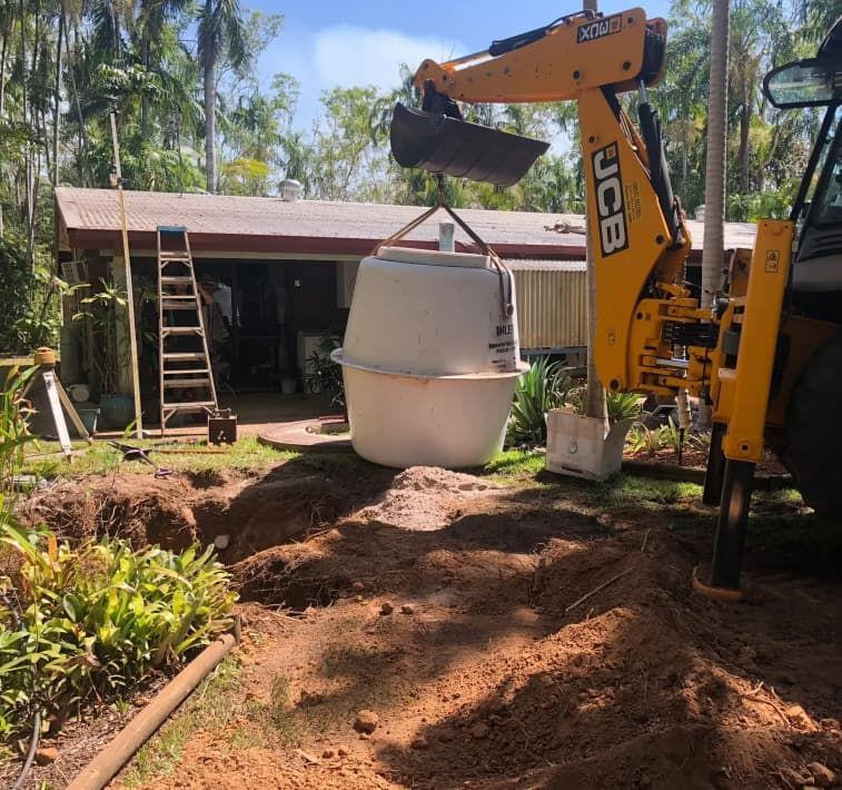 A Yellow Excavator is Lifting a Large White Object — Fastcall Group In Herbert, NT