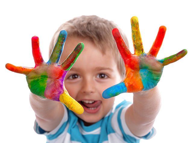 Child Development Program — Boy with the painted hand in Oakland, CA