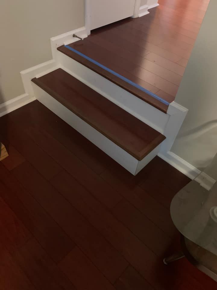 A set of stairs with wooden steps and white trim