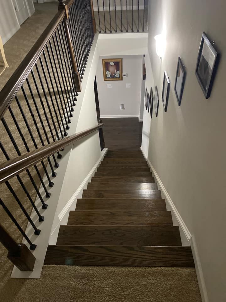 A wooden staircase leading up to the second floor of a house.