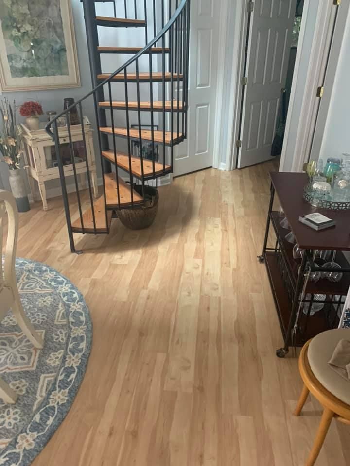 There is a spiral staircase in the middle of the room.