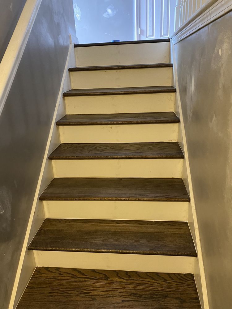 A set of stairs with wooden steps in a house.