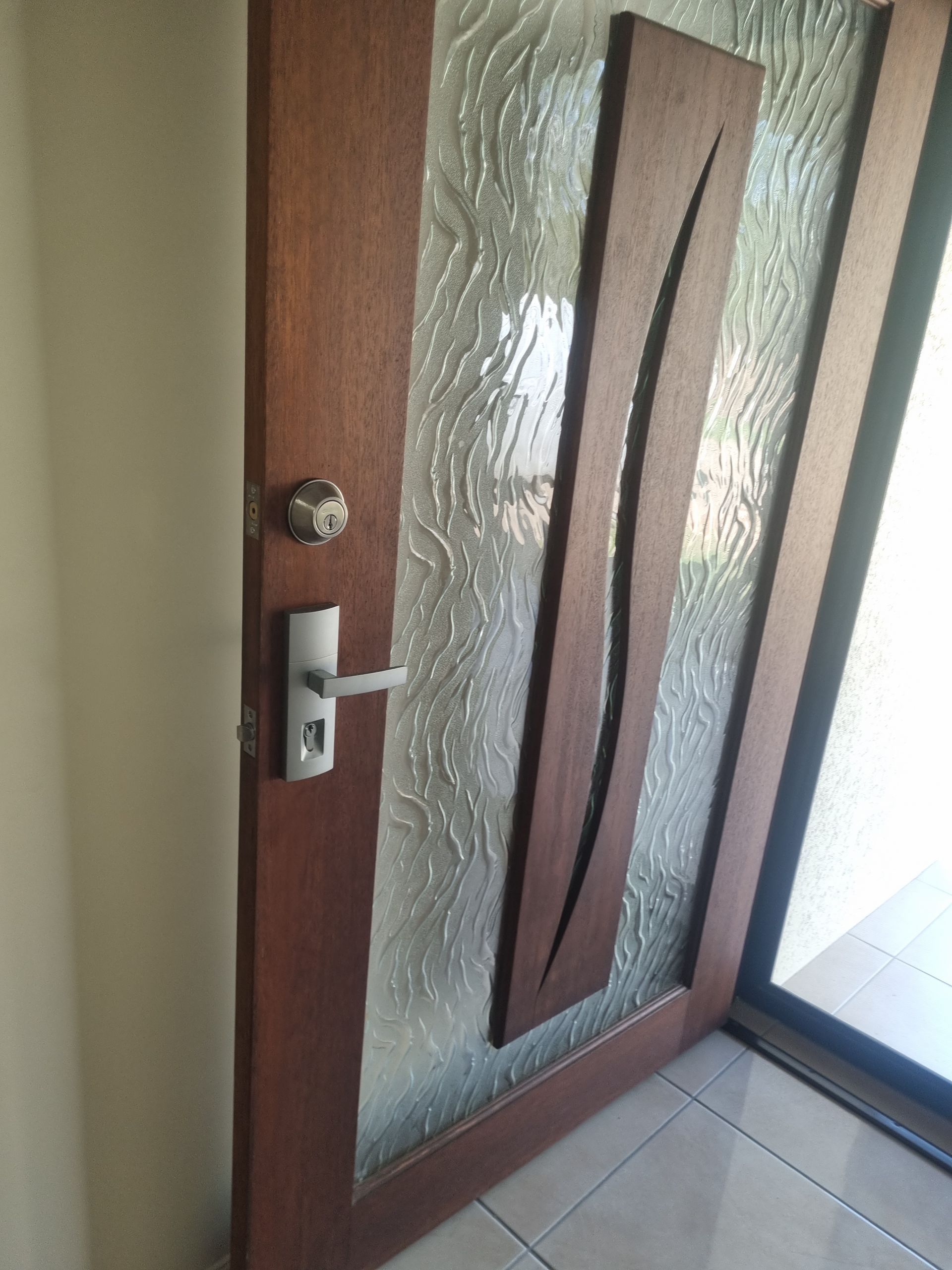 Brown Door With Silver Door Lock — Locksmith in Annandale, QLD