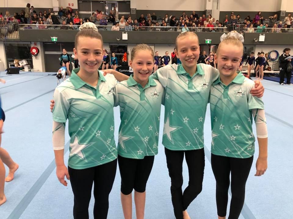 Four Girls Wearing Polo Shirt With Star Print — Promotional Apparel In Shellharbour, NSW