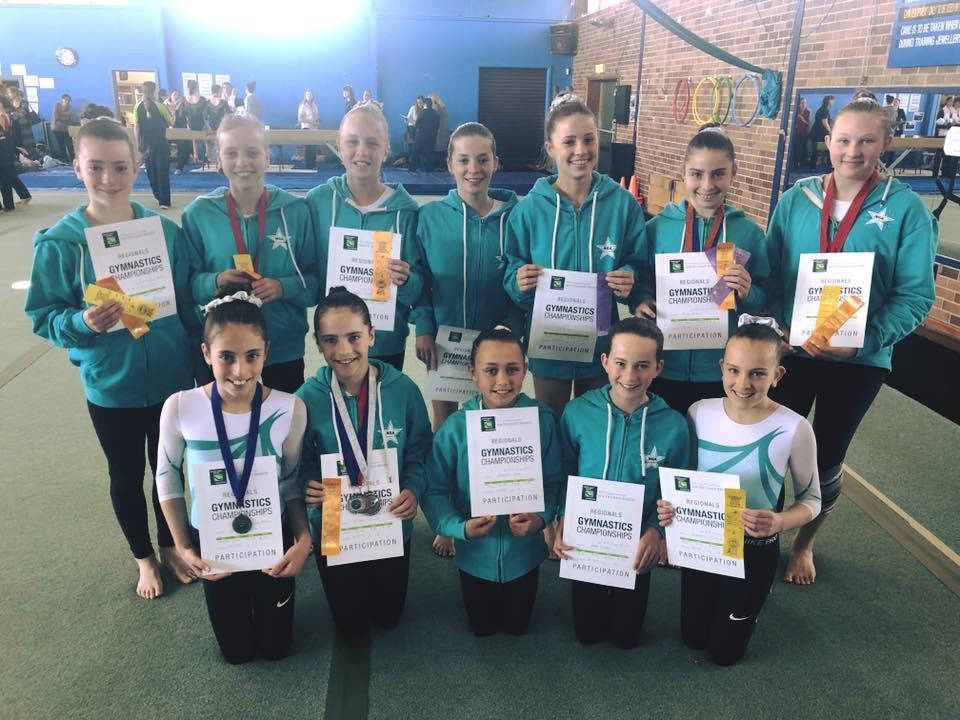 Group Of Girls Holding A Certificate — Promotional Apparel In Woonona, NSW