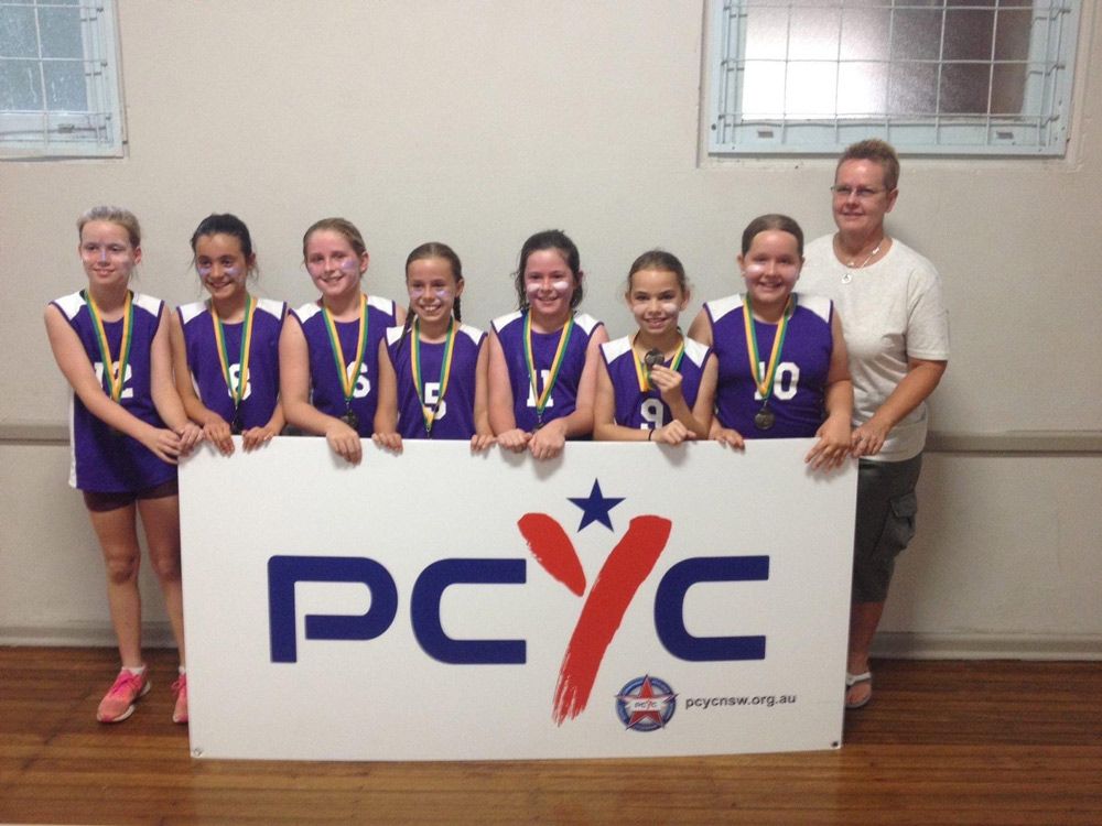 Girls Wth Medals Wearing Printed Blue Shirt — Promotional Apparel In Woonona, NSW