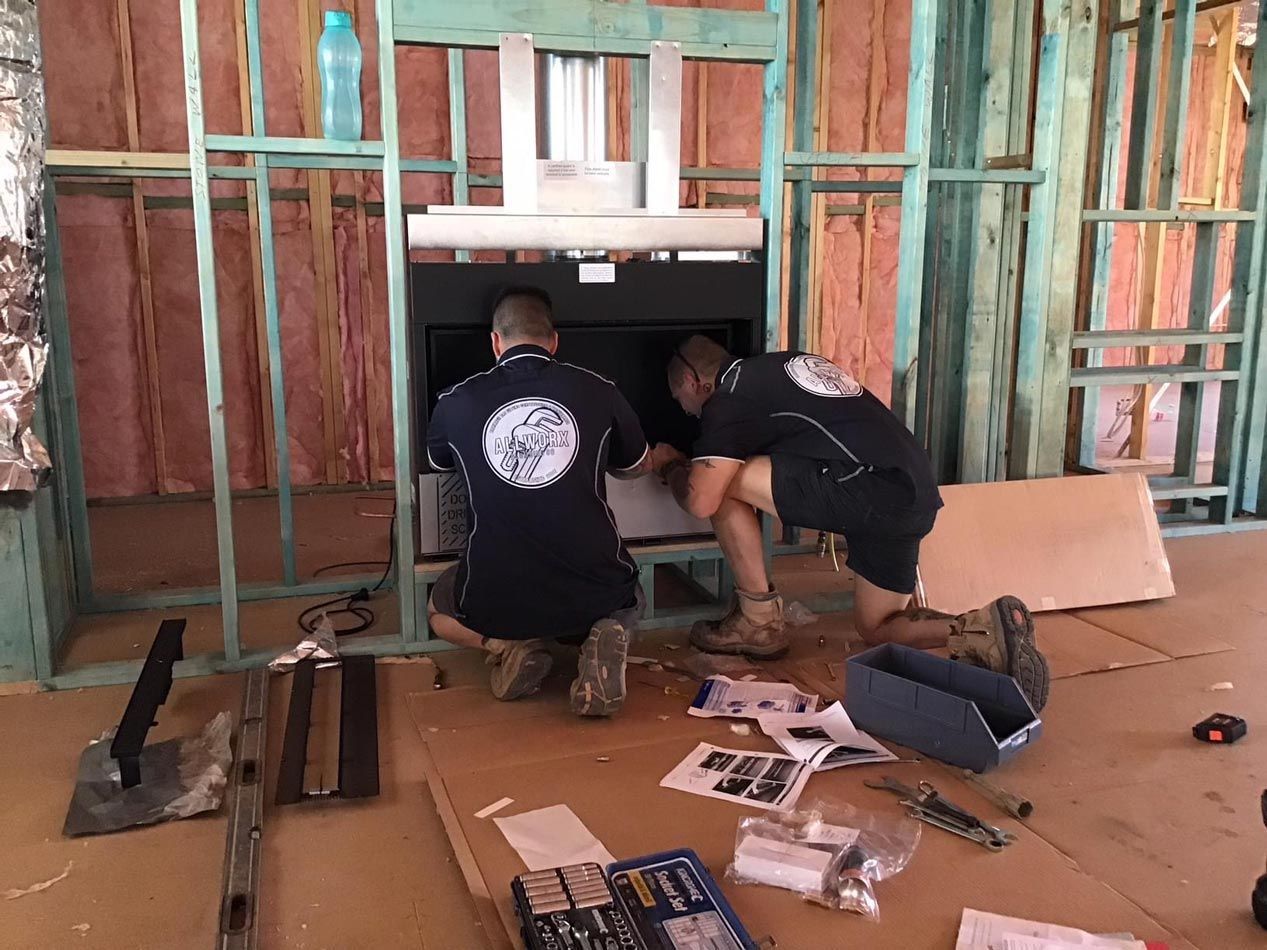 Two Men Wearing All Work company Logo T-shirt Repairing Using Tools — Promotional Apparel In Shellharbour, NSW