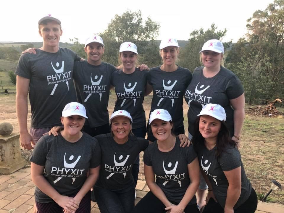 Group Of People Wearing Printed Black Shirt And White Cap At The Open Area — Promotional Apparel In Woonona, NSW