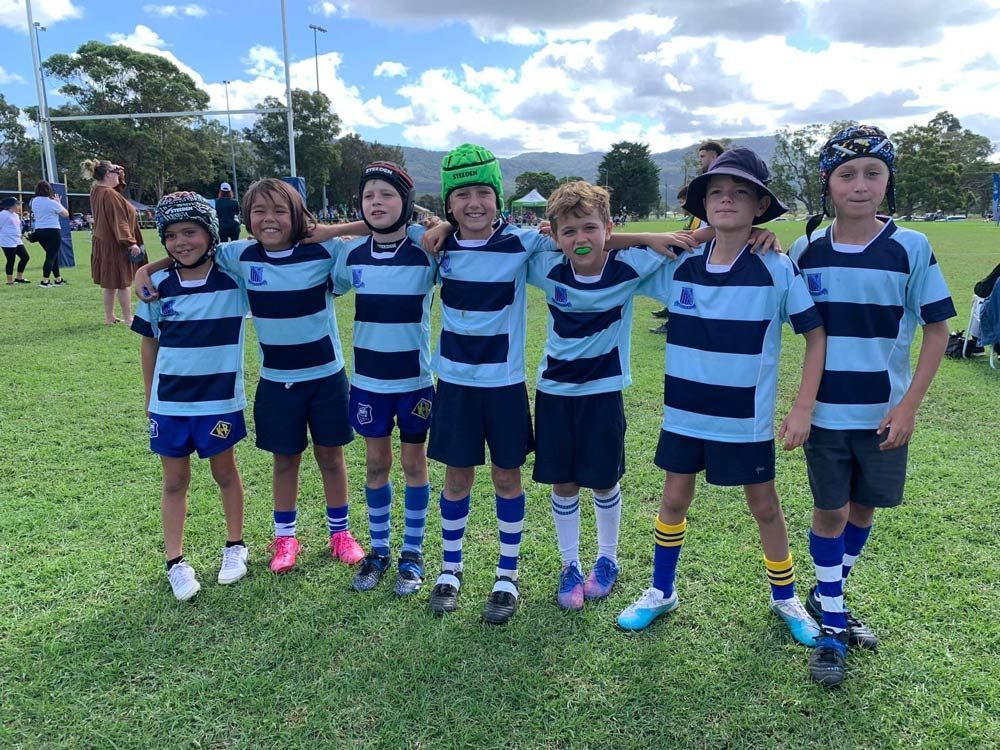 Kids Wearing Their Sports Attire At The Field — Promotional Apparel In Woonona, NSW