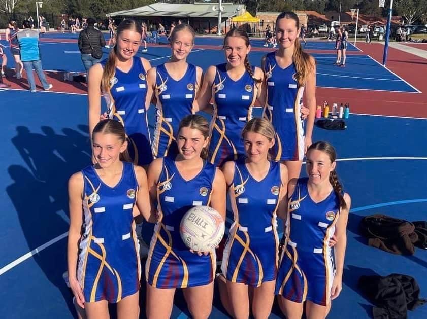 Group Of Women Wearing Volleyball Uniforms At The Court — Promotional Apparel In Woonona, NSW