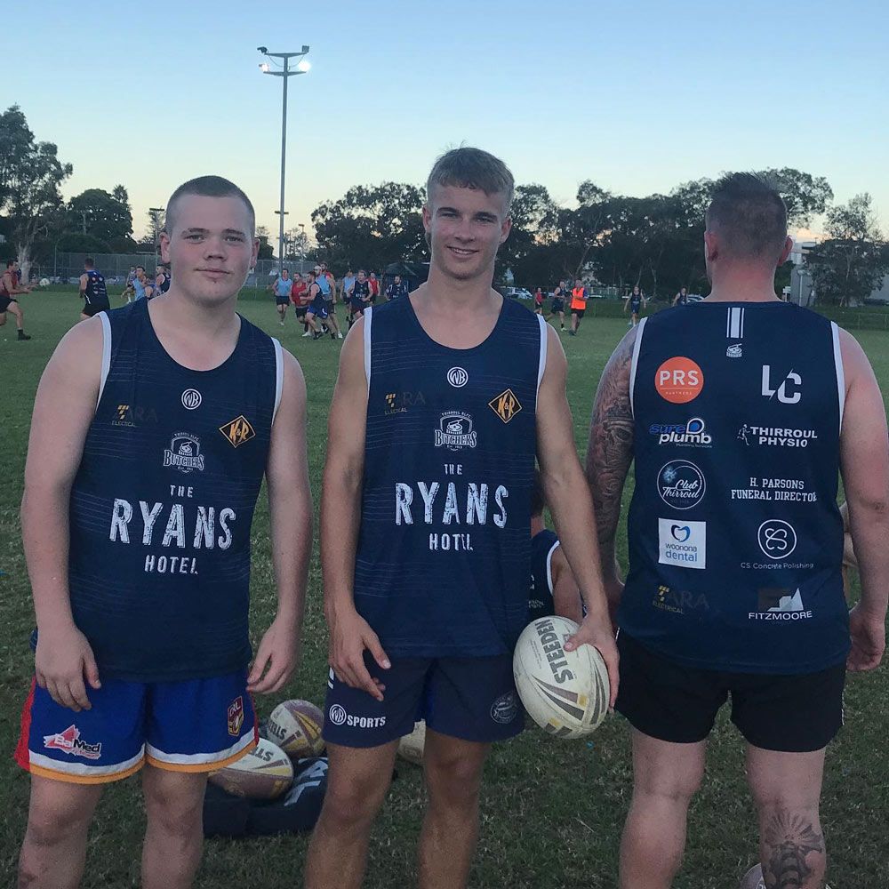 Three Men Wearing Customized Football Uniform — Promotional Apparel In Woonona, NSW