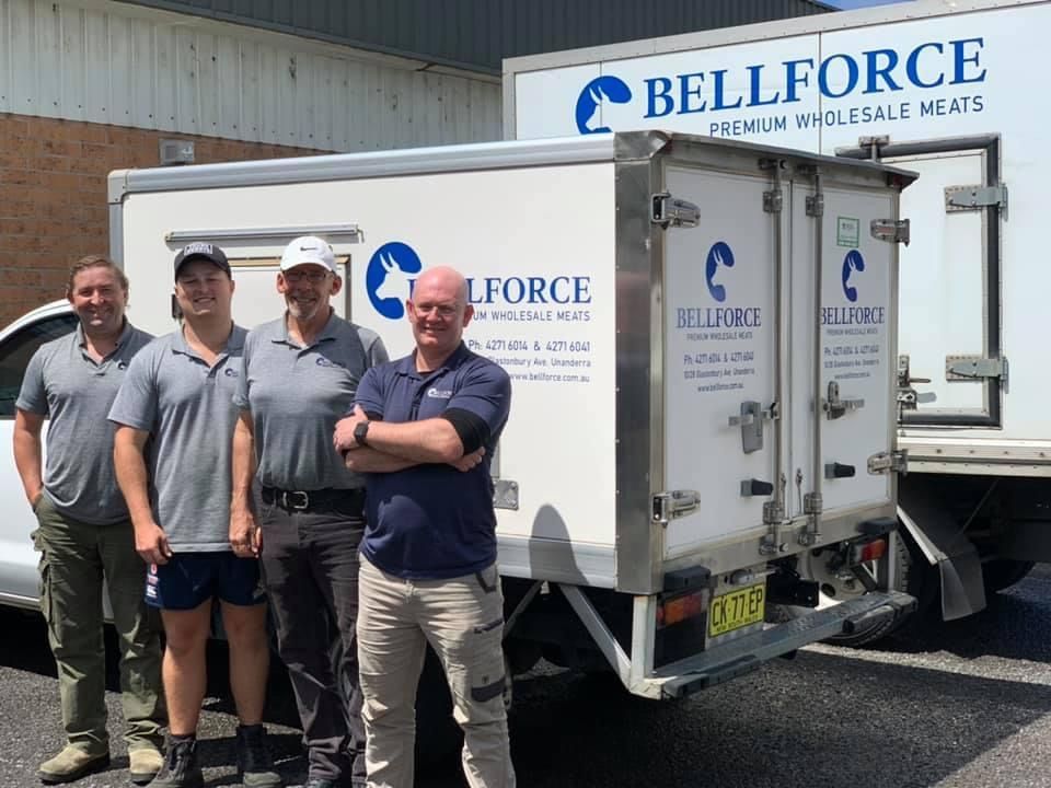 Group Of Men With White Truck Background — Promotional Apparel In Kiama, NSW