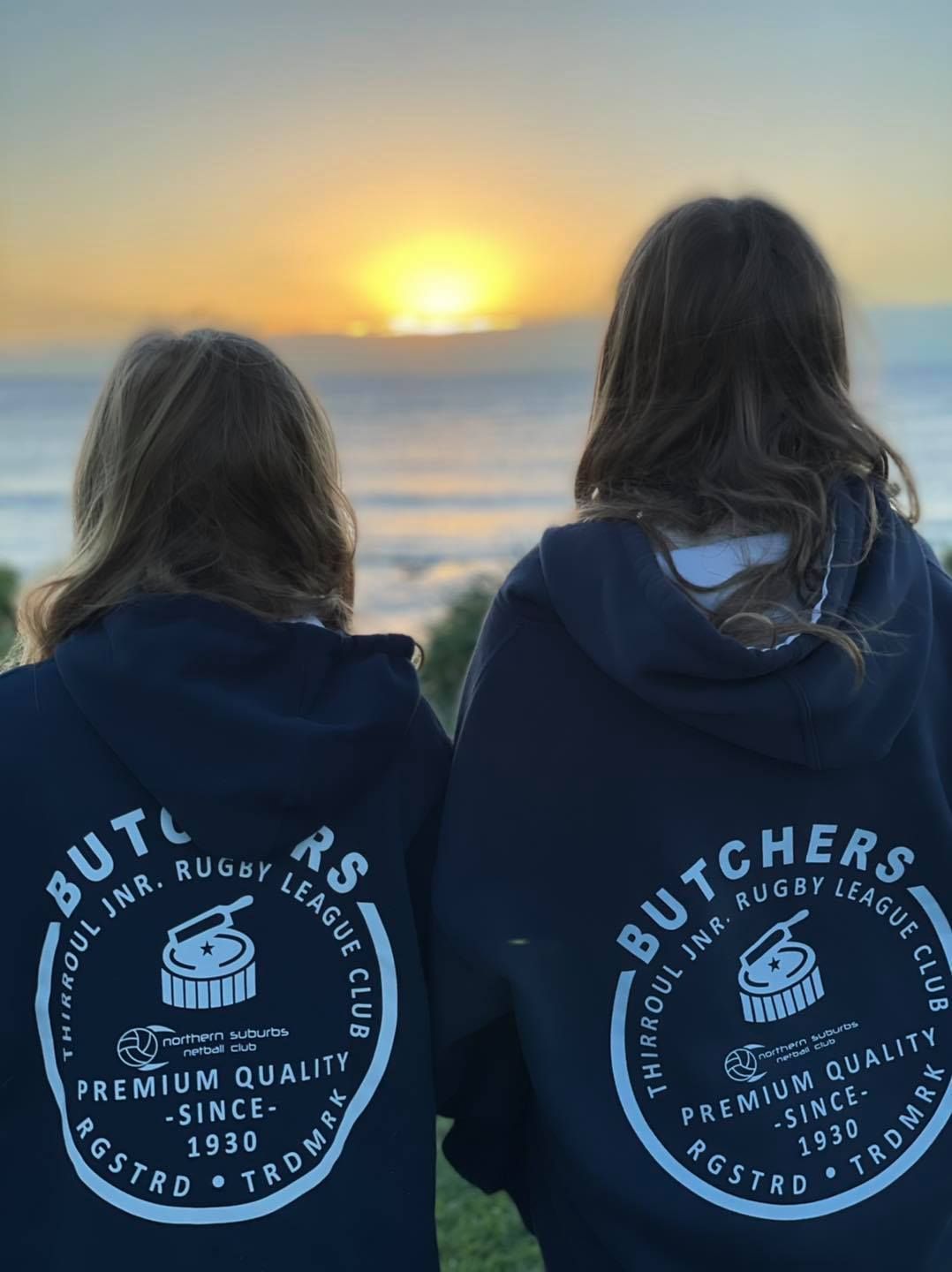 Two Ladies Wearing Custom Printed Jacket With Sunset Background — Promotional Apparel In Woonona, NSW