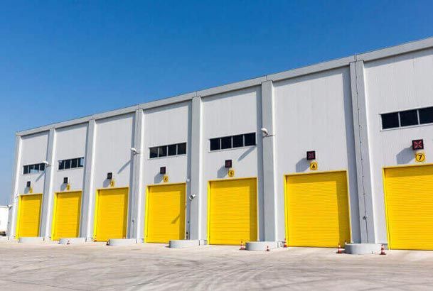 Yellow Warehouse Roll Up — Garage Door Service in Pilot Point, TX 76258