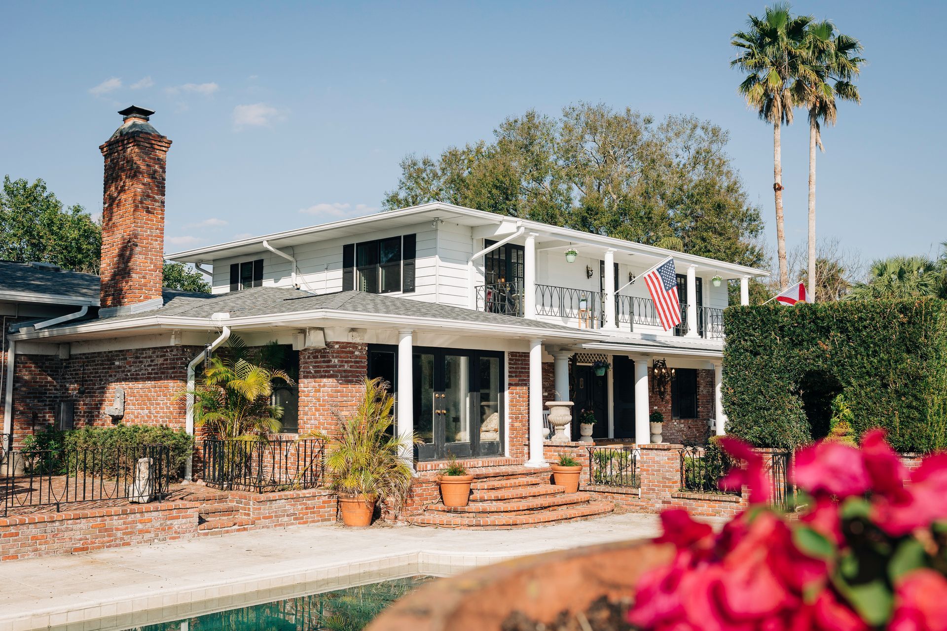 View of a historic home from the pool deck