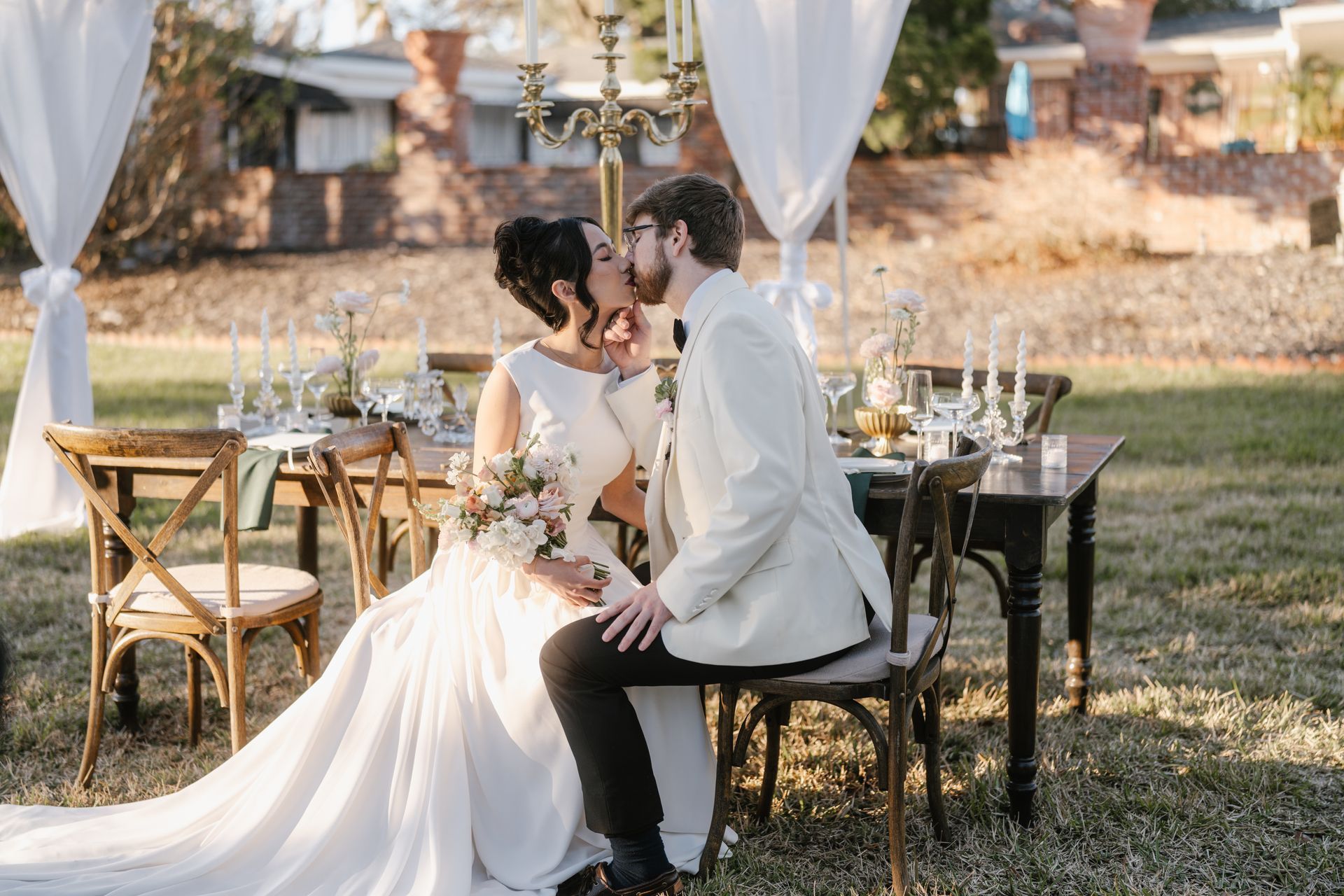 Bride and Groom kissing during  wedding reception.