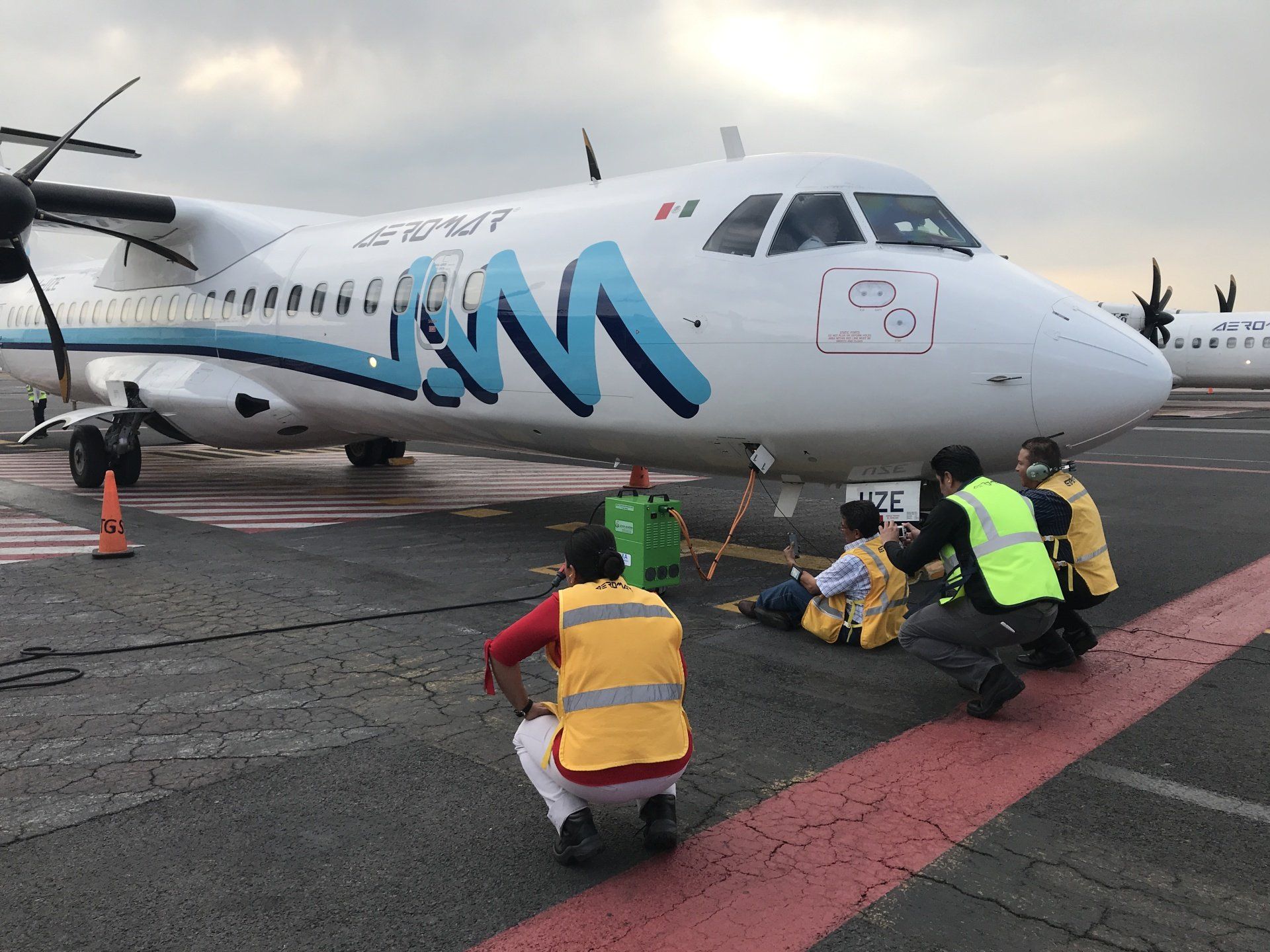 Aircraft engineers examining airplane