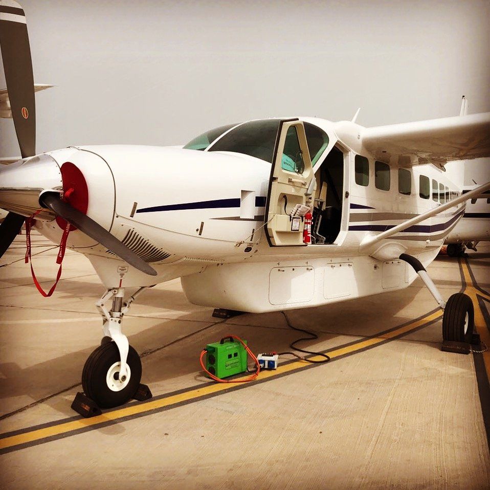 Portable 28VDC Continuous Power Unit connected to airplane