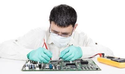 man working on circuit board