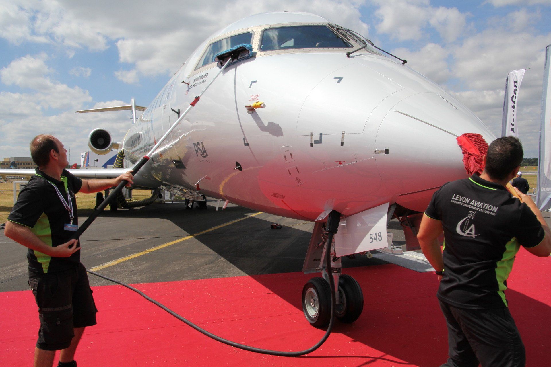 Aircraft engineers examining plane checklist