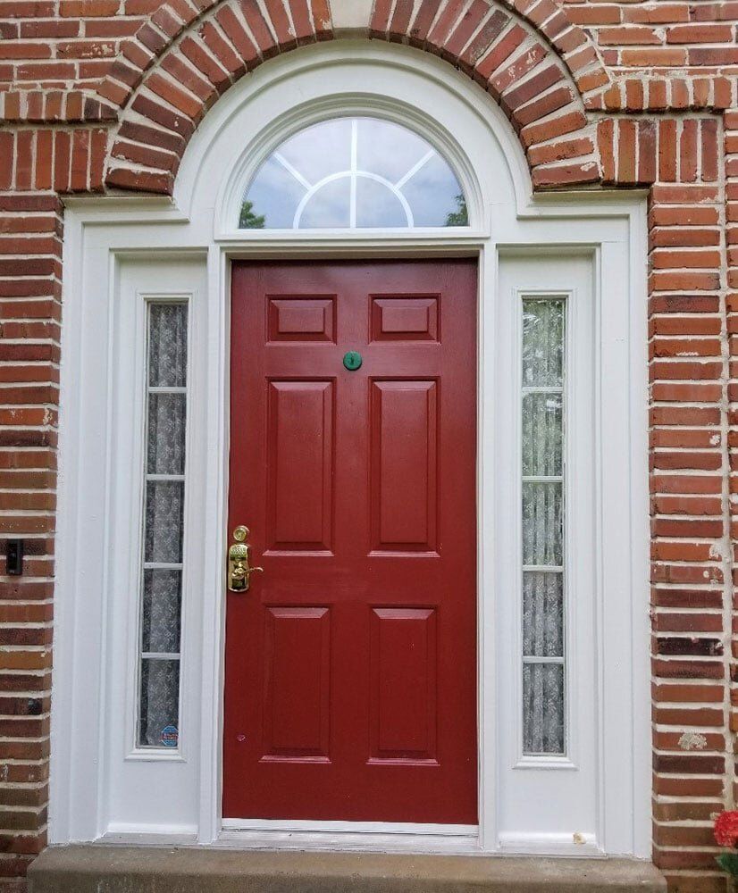 Front view of door with gold door knob — Foristell, MO — Master of Repair Services, LLC