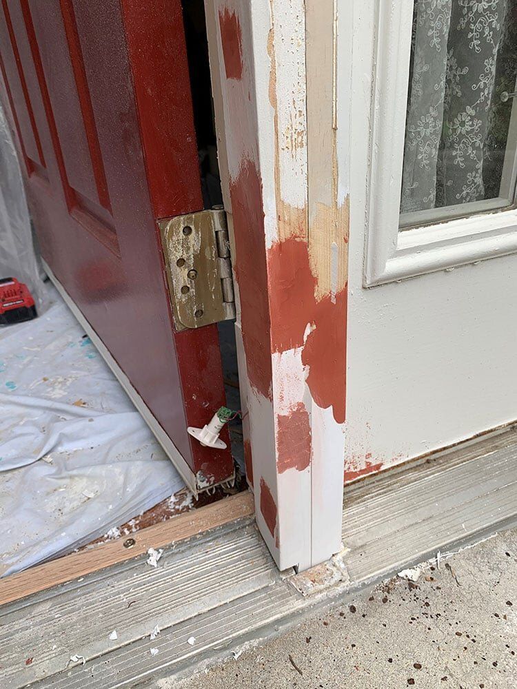 Door frame with dark brown putty — Foristell, MO — Master of Repair Services, LLC