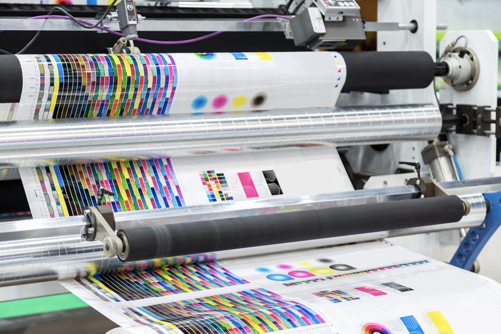Large Printing Machine Printing Chart Running A Long Roll Off Paper — Graphic Designer In Wollongong, QLD