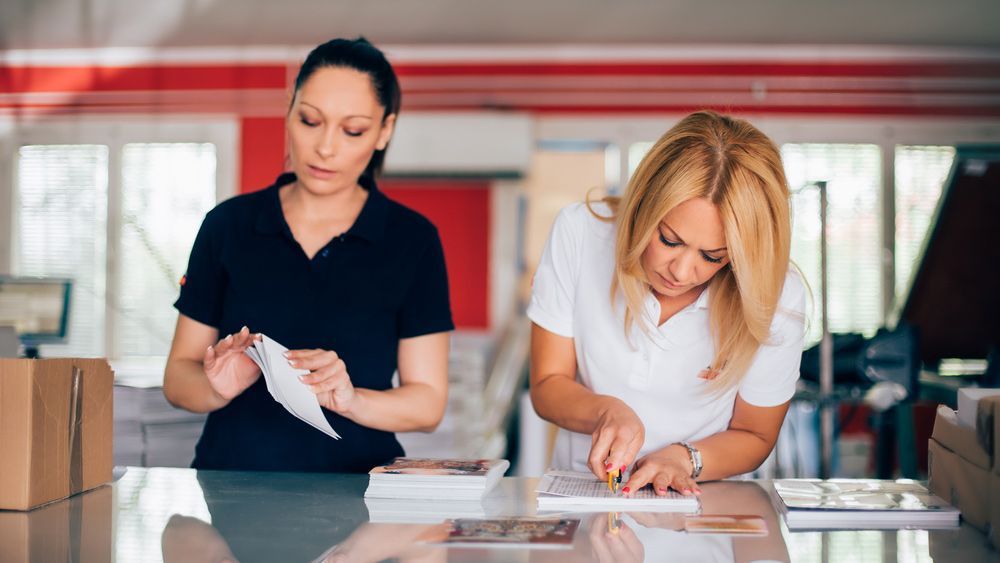 Woman Working In Printing Shop — Graphic Designer In Airlie Beach, QLD