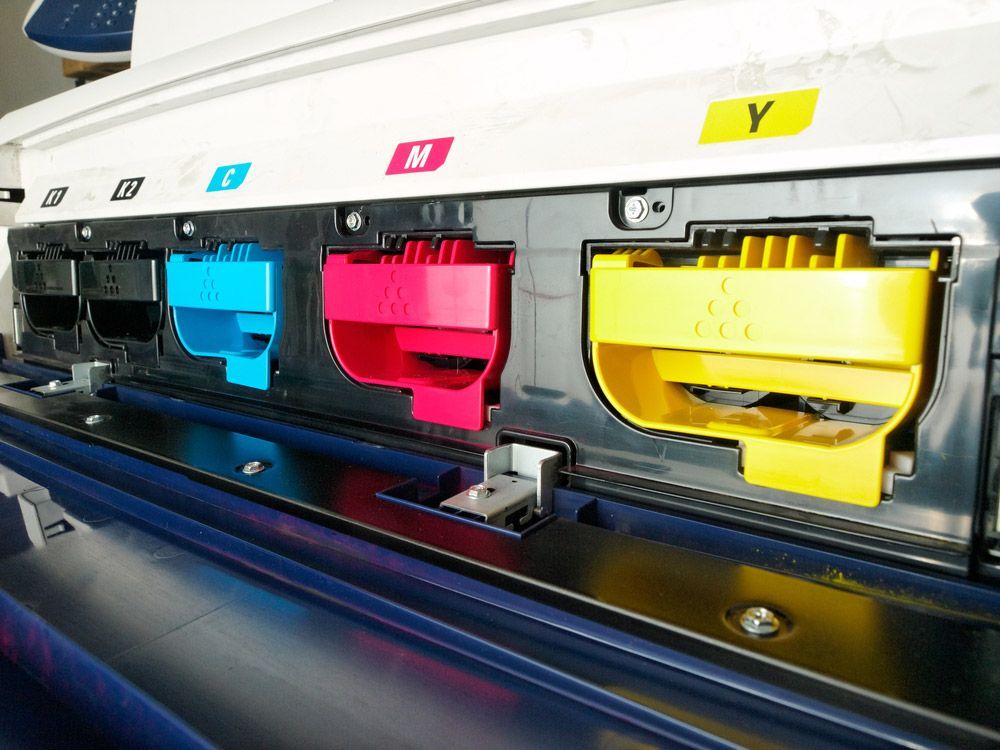 Close Up Of Printer Toner Cartridges — Graphic Designer In Wollongong, QLD