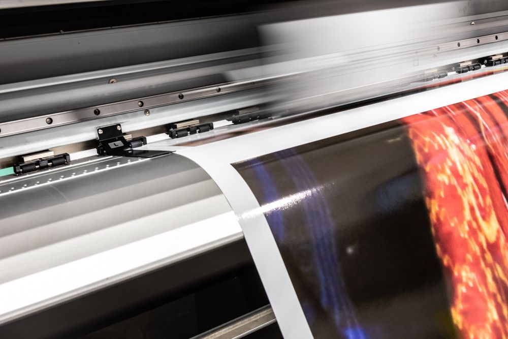 Printing Machine During Production — Graphic Designer In Airlie Beach, QLD