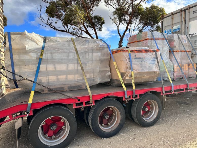 A Red Trailer With a Bunch of Boxes on It — Goulburn Transport In Goulburn, NSW