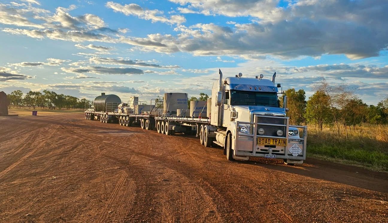 A white truck with multiple trailers behind — Goulburn Transport In Goulburn, NSW