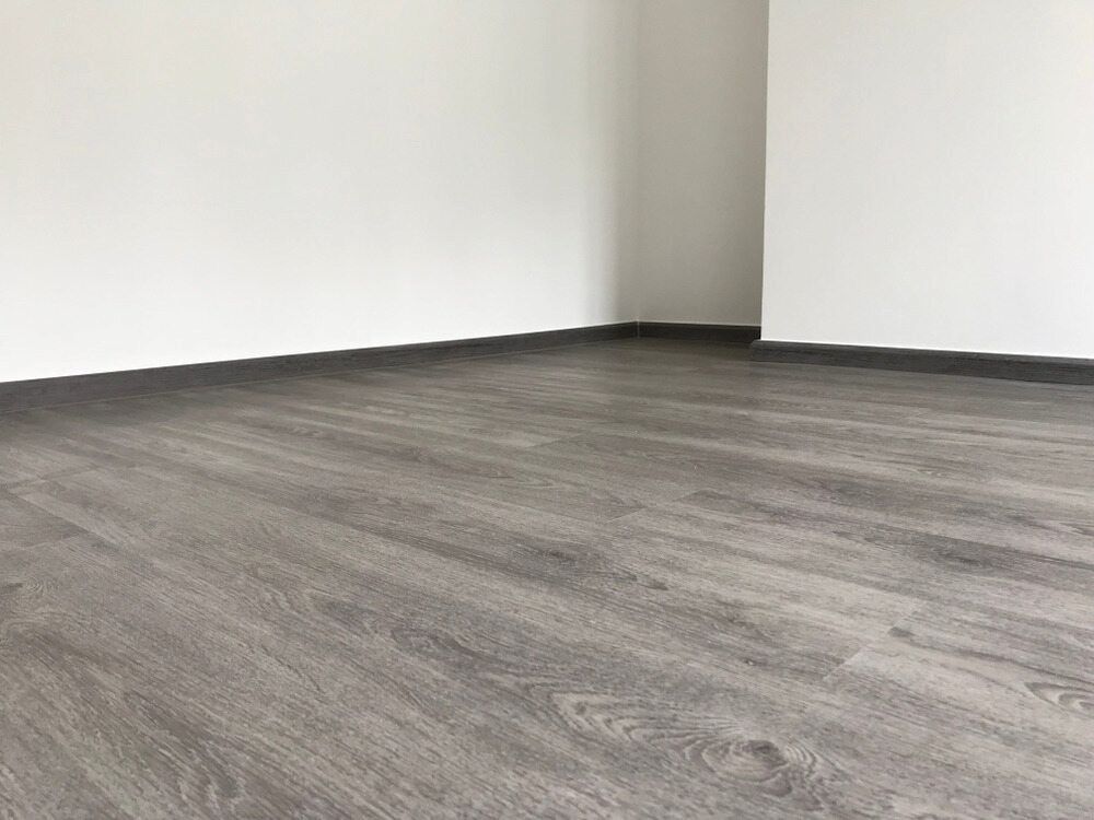 An Empty Room With A Wooden Floor And White Walls — Heness Painting In Park Avenue, QLD