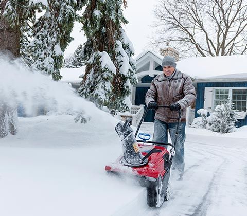 Man Using Snow Blower | Eastlake, OH | Willoscape Landscape Management