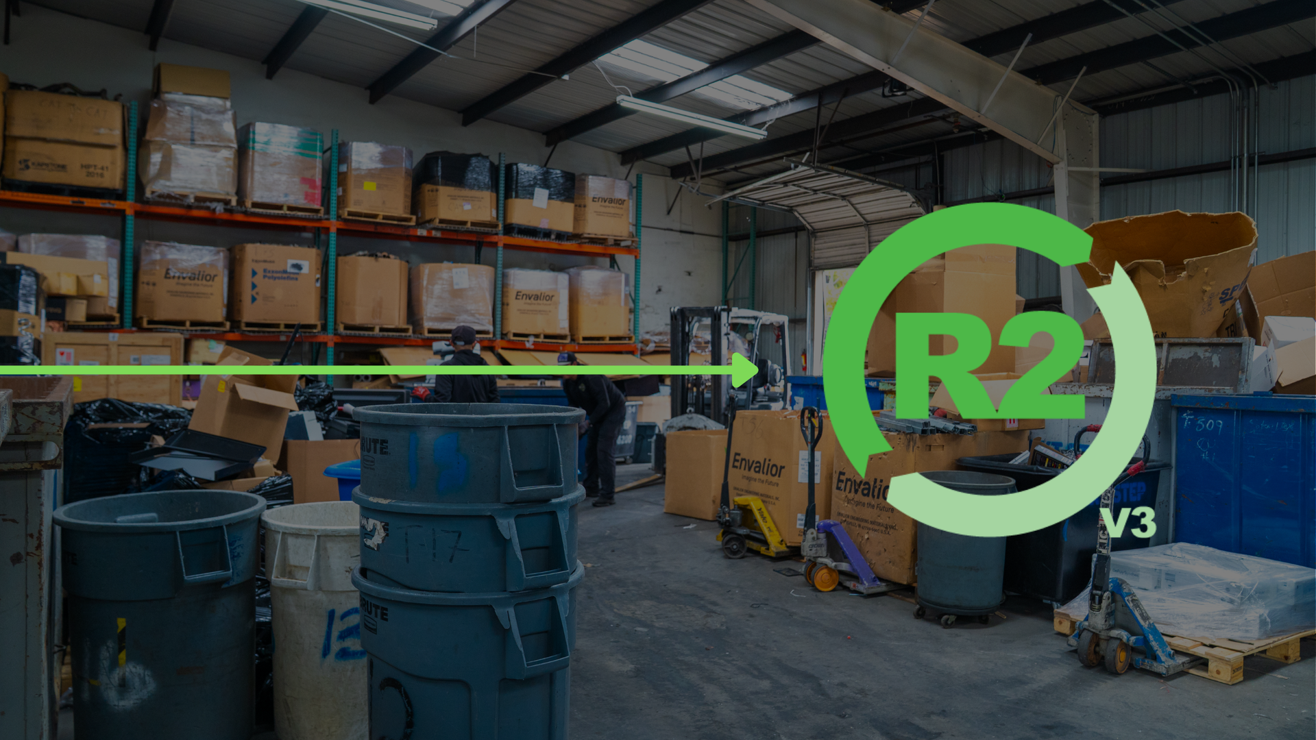 R2v3 recycling certification logo with a recycling center interior in the background