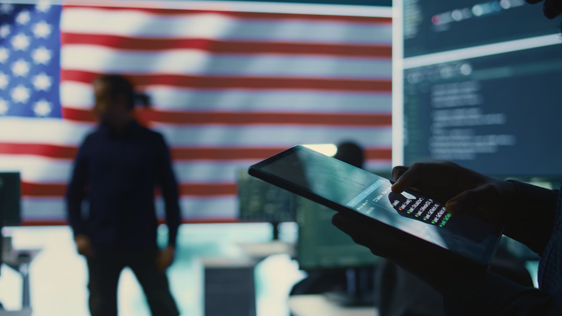 close up of a government it devices with the flag of the USA for it asset disposition concept