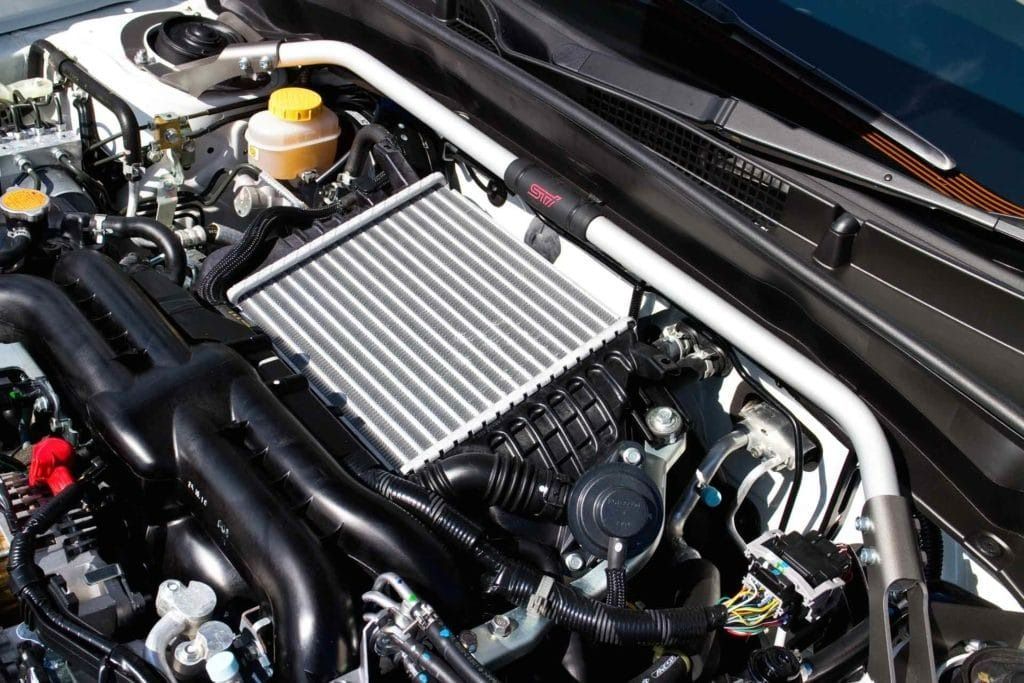 Car Engine Bay With Intercooler and Strut Bar — Bundaberg Radiator Service in Bundaberg East, QLD