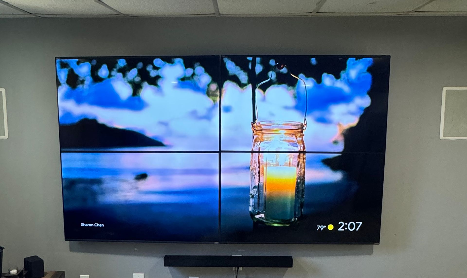 A large flat screen tv is hanging on a wall.