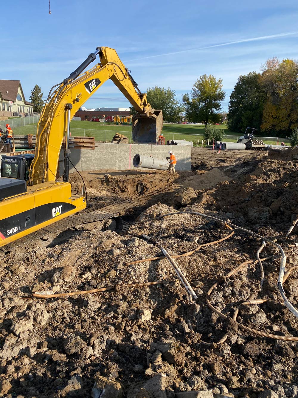 Working Excavation in A Wide Field — Chaska, MN — Kusske Construction Company