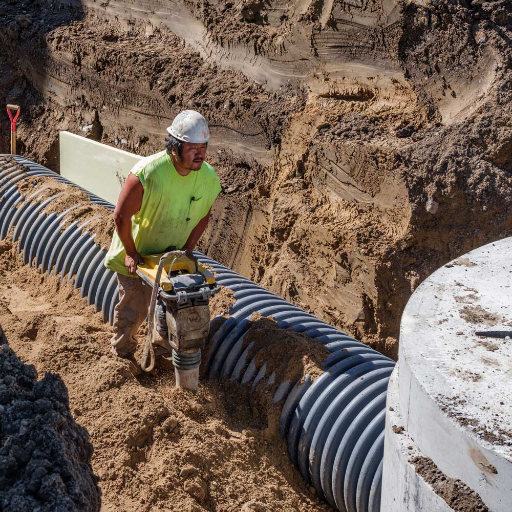 Man Working Underground — Chaska, MN — Kusske Construction Company