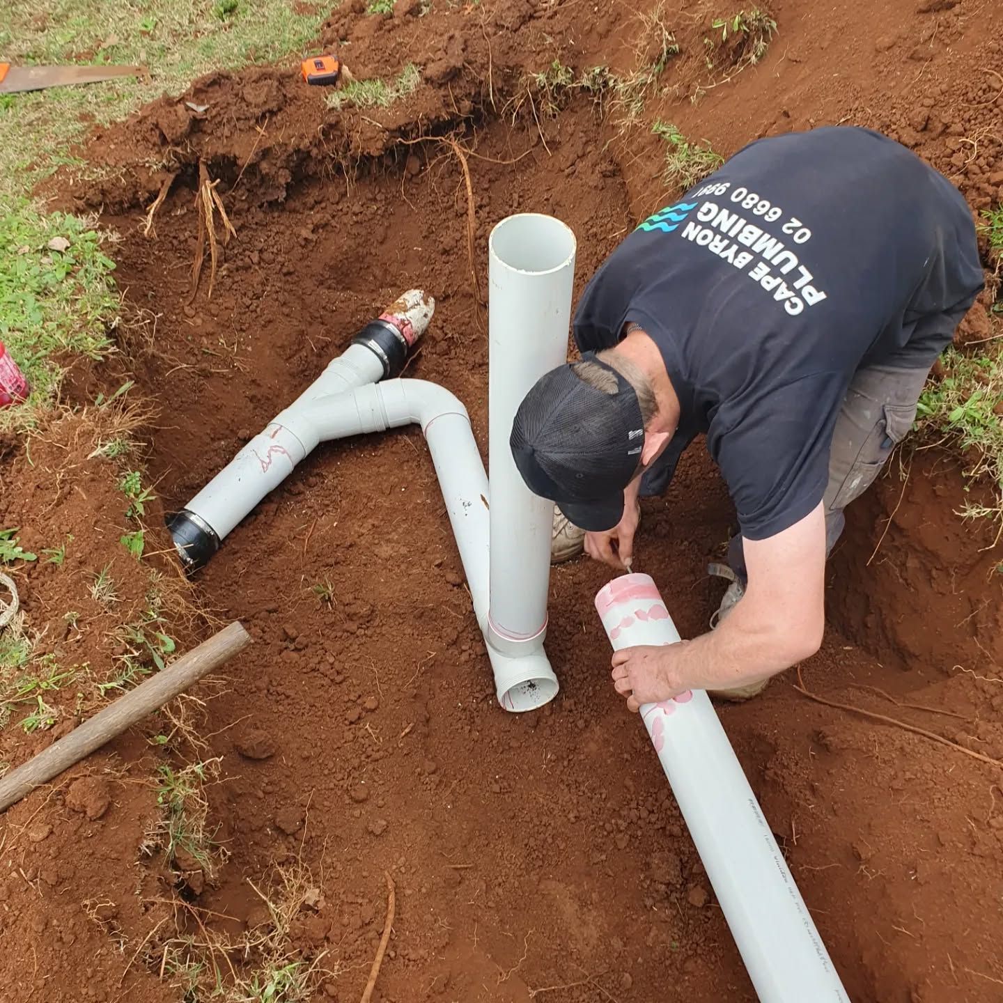 plumber in Mullumbimby preparing PVC piping during a pipe relining job